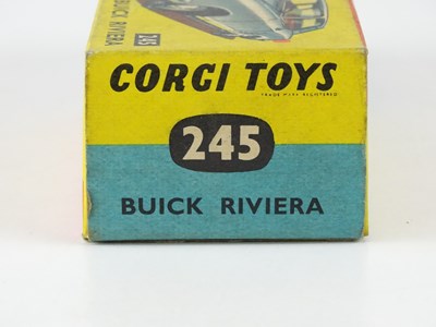 Lot 12 - A CORGI 245 Buick Riviera in metallic gold...