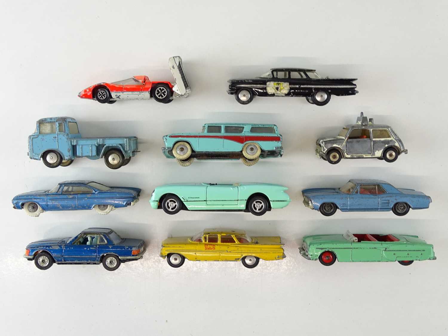 Lot 135 - A group of playworn diecast cars by CORGI,...