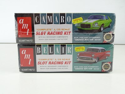 Lot 153 - A pair of AMT 1:32 scale slot car racing...