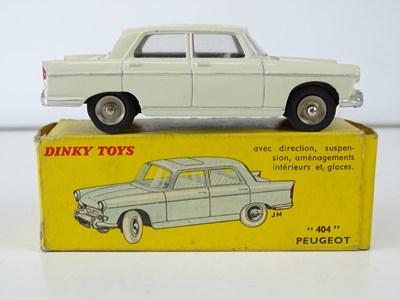 Lot 15 - A FRENCH DINKY 553 Peugeot 404 in cream with...