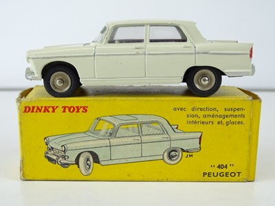 Lot 15 - A FRENCH DINKY 553 Peugeot 404 in cream with...