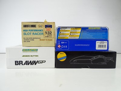 Lot 156 - A group of slot racing cars comprising a pair...