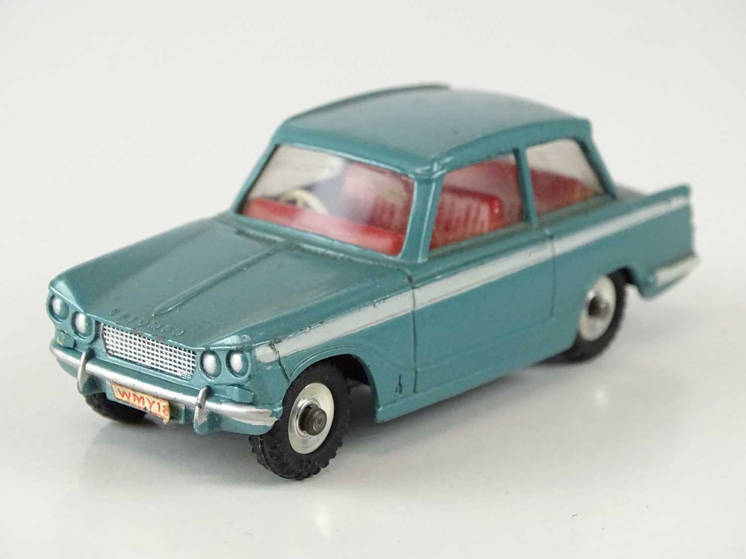 Lot 16 - A DINKY 134 Triumph Vitesse in blue with red...