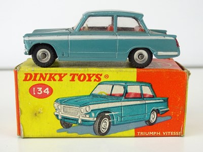 Lot 16 - A DINKY 134 Triumph Vitesse in blue with red...