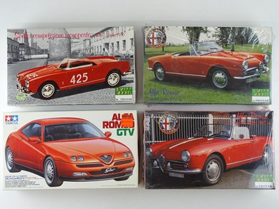 Lot 186 - A group of unbuilt 1:24 scale plastic car kits,...