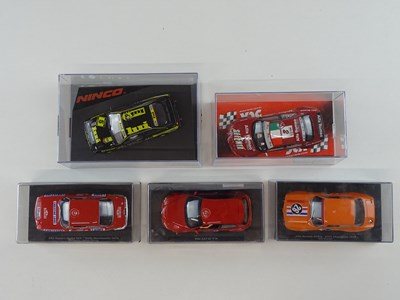 Lot 202 - A group of 1:32 scale slot racing cars by...