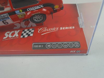 Lot 203 - A group of 1:32 scale slot racing cars by SCX...