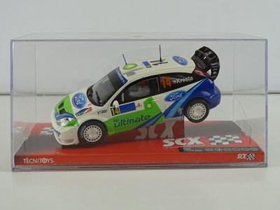 Lot 203 - A group of 1:32 scale slot racing cars by SCX...