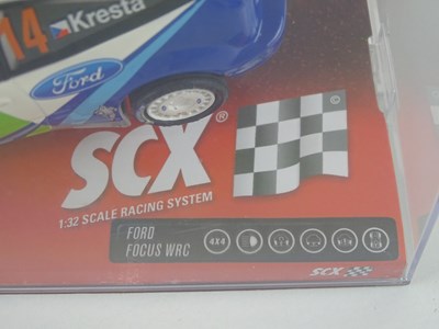 Lot 203 - A group of 1:32 scale slot racing cars by SCX...