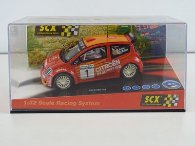 Lot 203 - A group of 1:32 scale slot racing cars by SCX...
