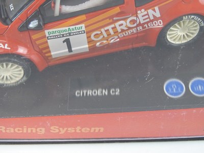 Lot 203 - A group of 1:32 scale slot racing cars by SCX...