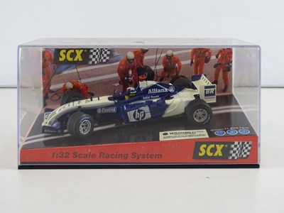 Lot 203 - A group of 1:32 scale slot racing cars by SCX...
