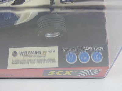 Lot 203 - A group of 1:32 scale slot racing cars by SCX...