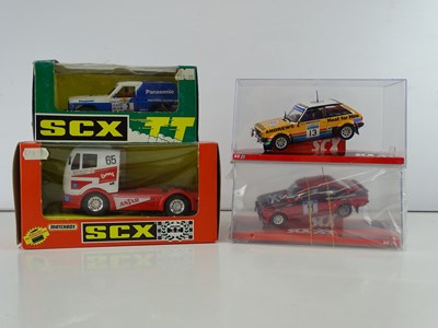 Lot 204 - A group of 1:32 scale slot racing vehicles by...