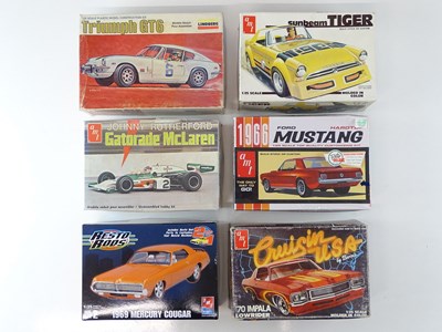 Lot 208 - A group of 1:25 scale plastic car kits by AMT...