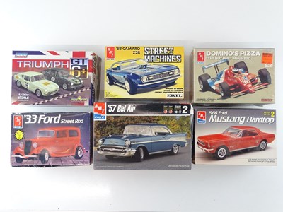 Lot 210 - A group of 1:25 scale plastic car kits by AMT...