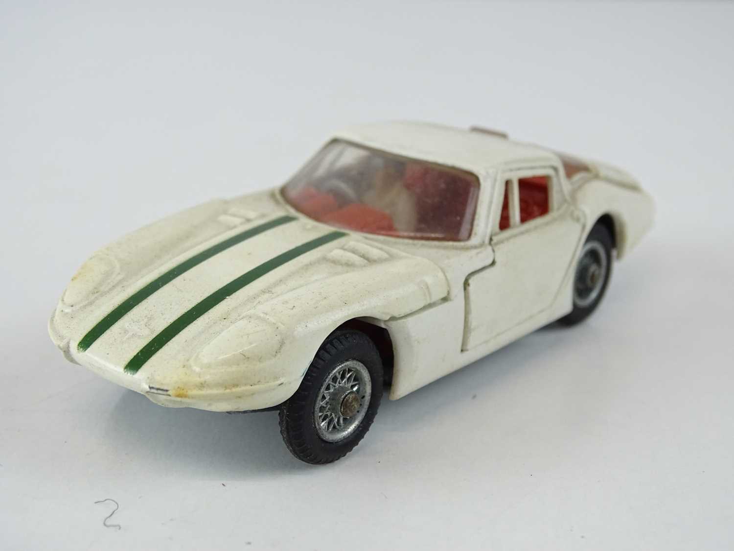Lot 21 - A CORGI 324 Marcos 1800 GT in white with green...