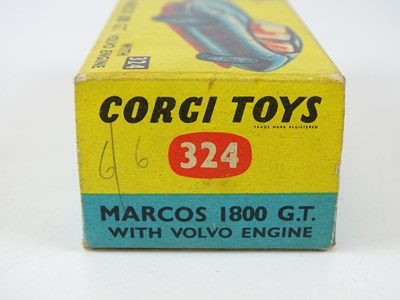 Lot 21 - A CORGI 324 Marcos 1800 GT in white with green...