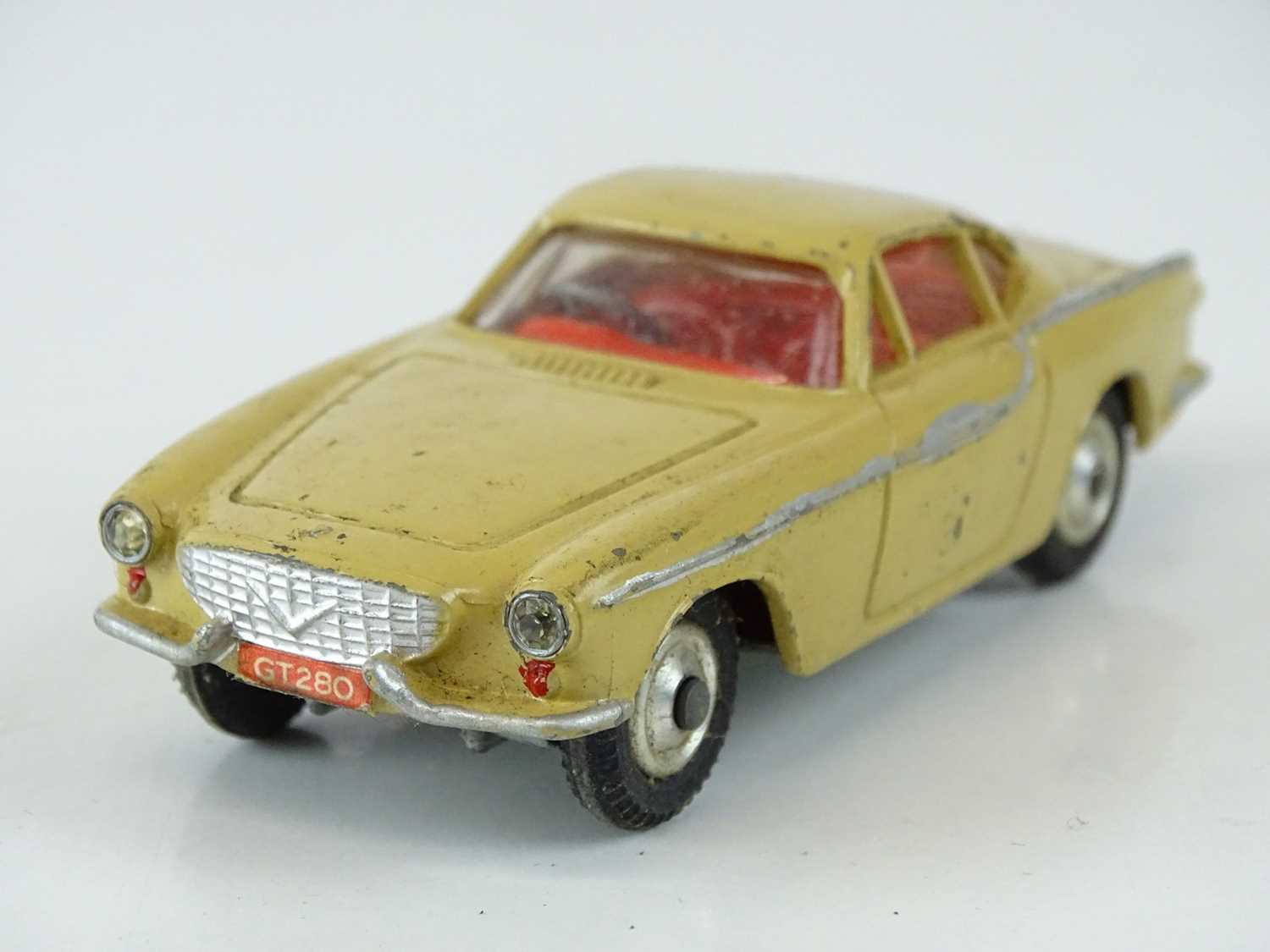 Lot 30 - A CORGI 228 Volvo P1800 in beige with red...
