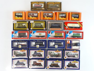 Lot 334 - A group of OO Gauge boxed wagons and coaches...