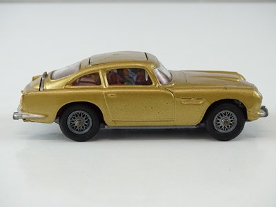 Lot 33 - A CORGI 261 James Bond's Aston Martin in gold...