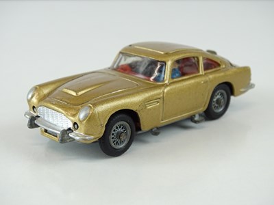 Lot 37 - A CORGI 261 James Bond's Aston Martin in gold...