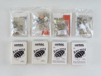 Lot 385 - A group of OO Gauge motor bogies and motor...