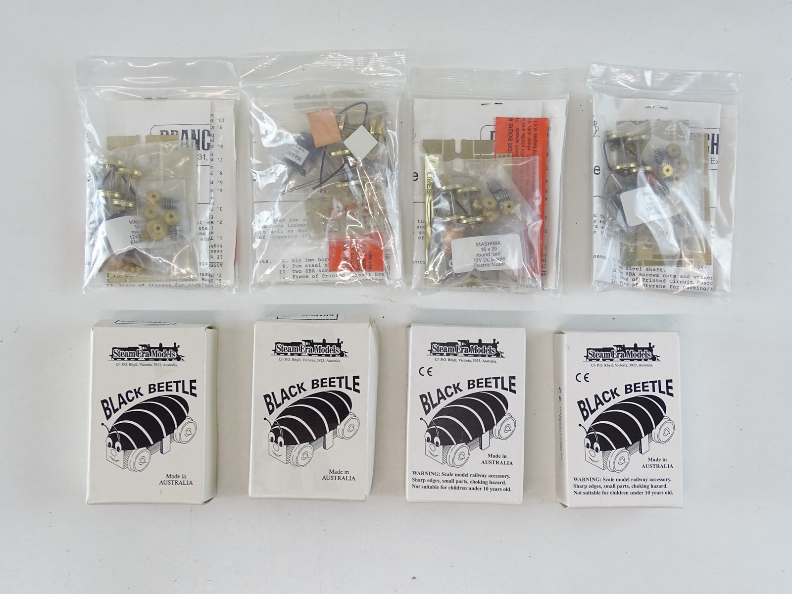 Lot 385 A group of OO Gauge motor bogies and motor