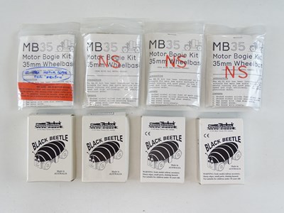 Lot 385 - A group of OO Gauge motor bogies and motor...