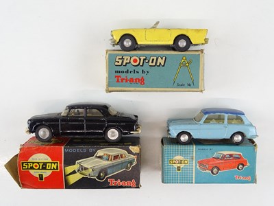 Lot 55 - A group of TRI-ANG SPOT-ON cars comprising 154,...