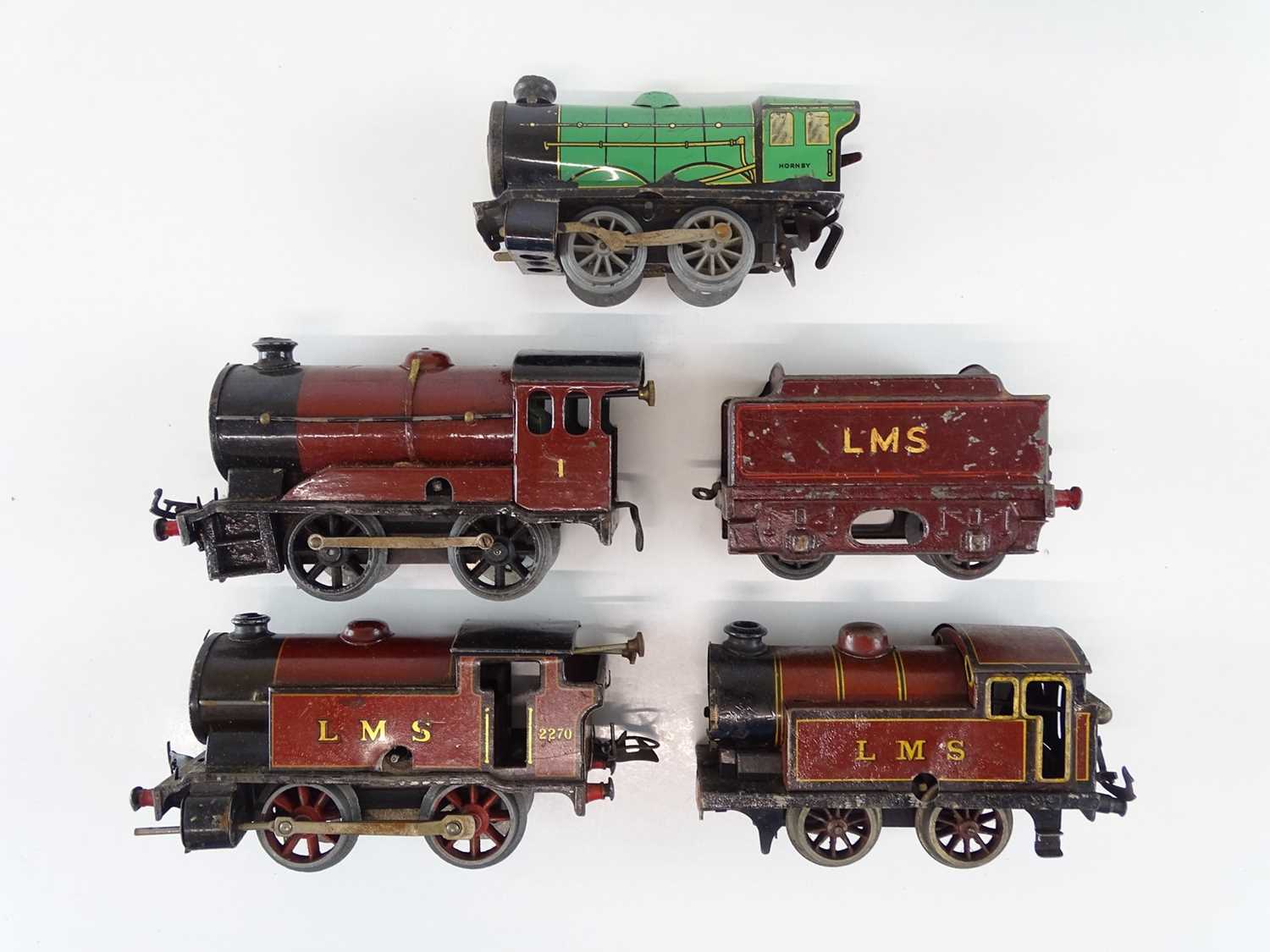 Lot 582 - A group of HORNBY O Gauge clockwork locos for...