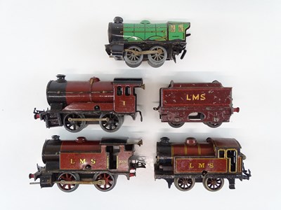 Lot 582 - A group of HORNBY O Gauge clockwork locos for...