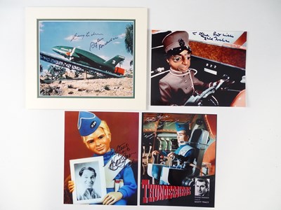 Lot 271 - A group of four Thunderbirds signed 10" x 8"...