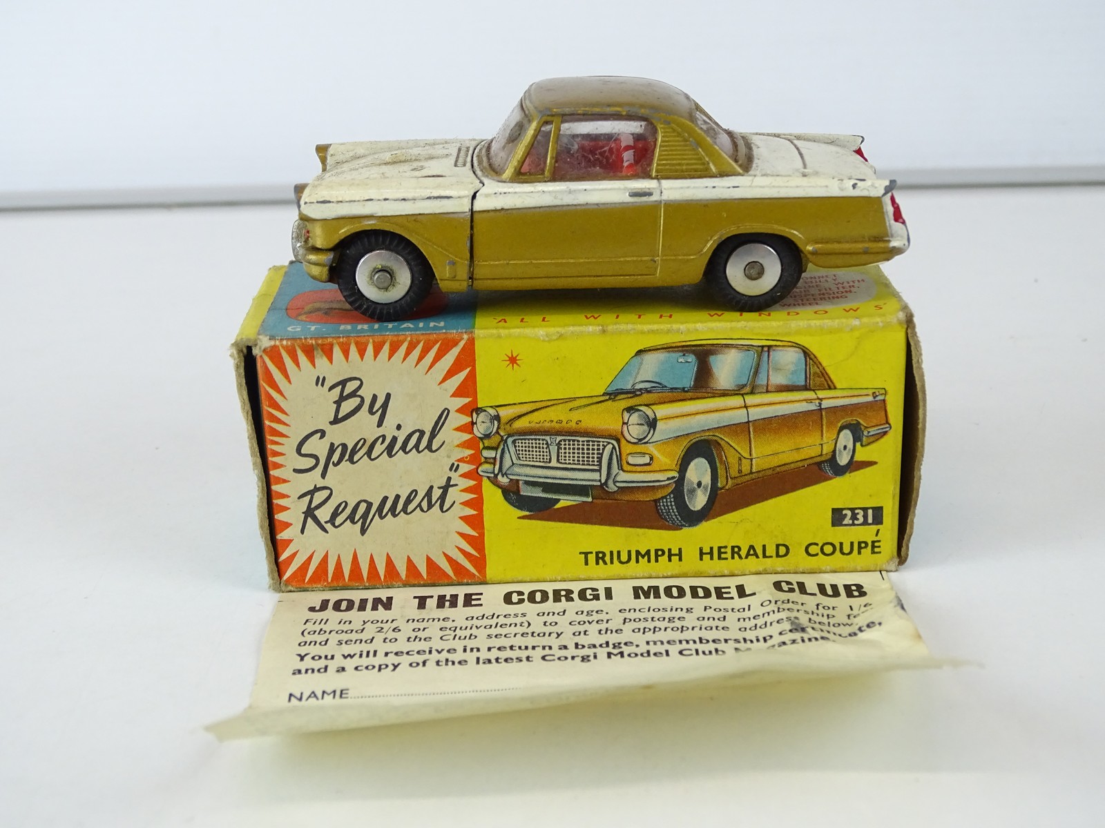 Lot 9 - A CORGI 231 Triumph Herald Coupe in gold/white