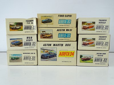 Lot 151 - A group of five unbuilt plastic car kits by...