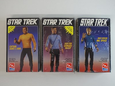 Lot 450 - A group of 12" vinyl figure kits by AMT...