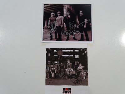 Lot 627 - BON JOVI - a pair of fully signed photos (2 in...