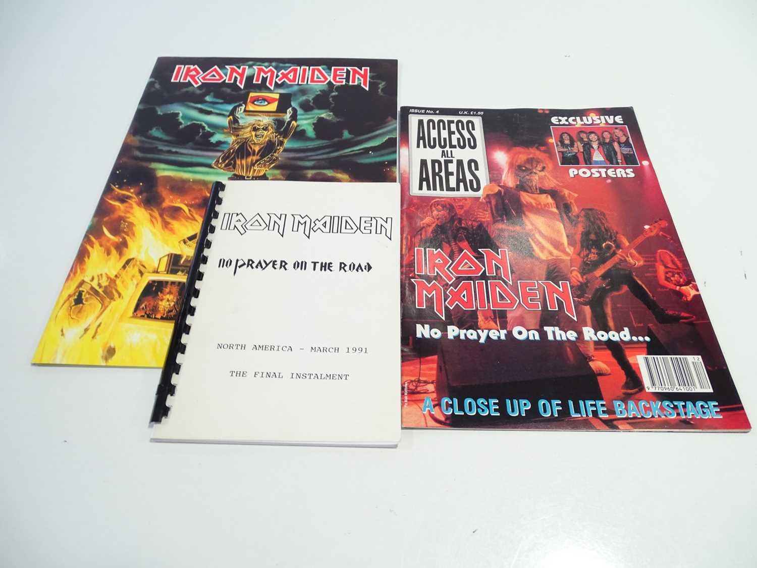 Lot 768 - IRON MAIDEN - a group of memorabilia items...