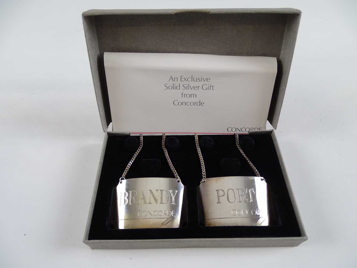 Lot 377 - A pair of solid silver decanter labels 'BRANDY'...