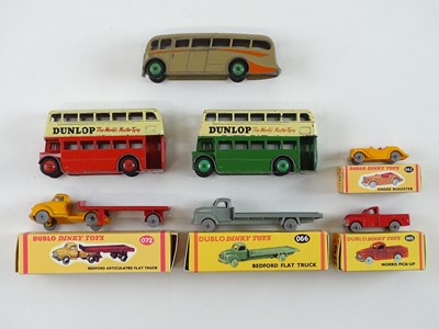 Lot 108 - A group of unboxed DINKY buses together with a...