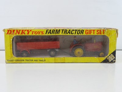 Lot 124 - A DINKY 399 Farm Tractor Gift Set containing a...