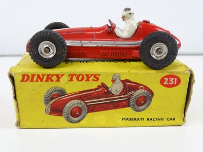 Lot 157 - A trio of DINKY racing cars comprising a 231...