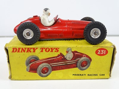 Lot 157 - A trio of DINKY racing cars comprising a 231...