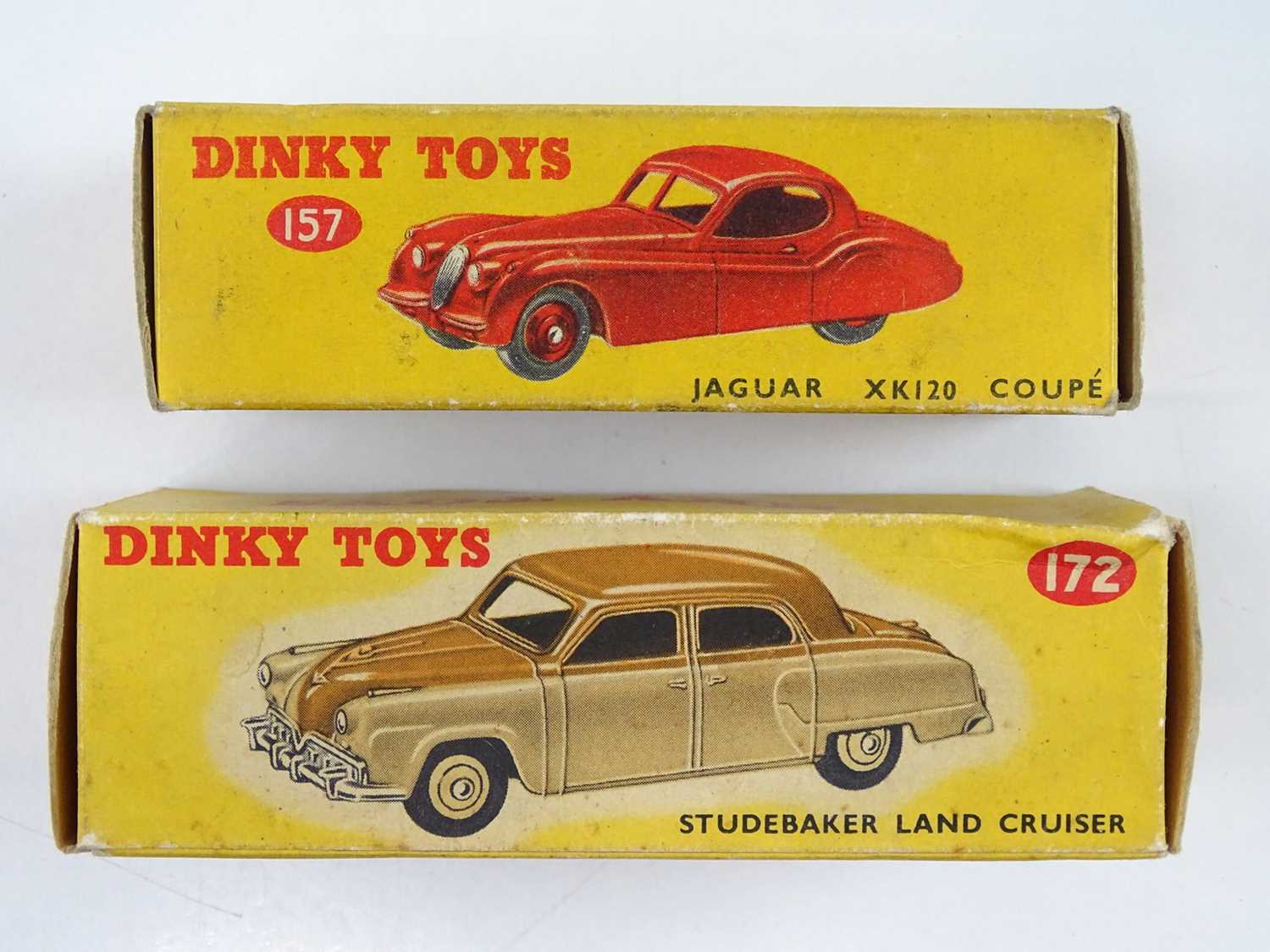 Lot 159 A pair of DINKY cars comprising a 157 Jaguar
