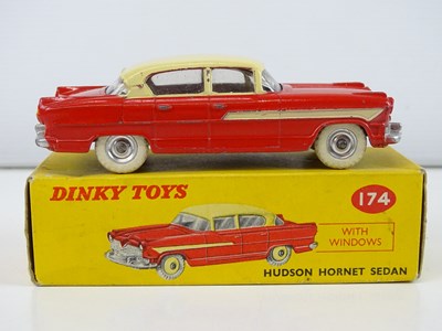 Lot 179 - A DINKY 174 Hudson Hornet Sedan in red/cream -...