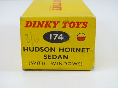 Lot 179 - A DINKY 174 Hudson Hornet Sedan in red/cream -...