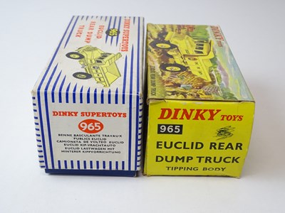 Lot 202 - A pair of DINKY 965 Euclid Dump Trucks, one in...