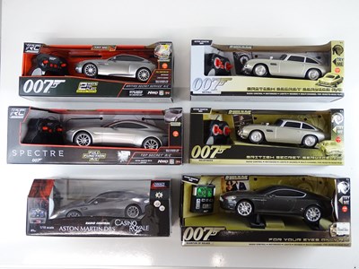 Lot 213 - A group of James Bond radio control Aston...