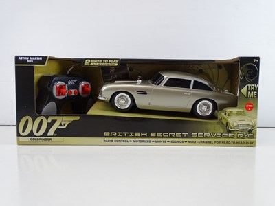 Lot 213 - A group of James Bond radio control Aston...