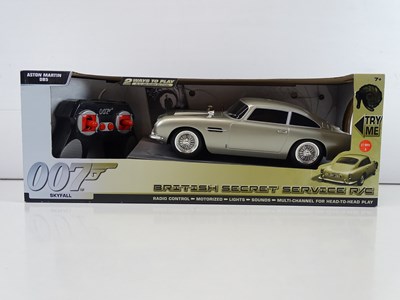 Lot 213 - A group of James Bond radio control Aston...